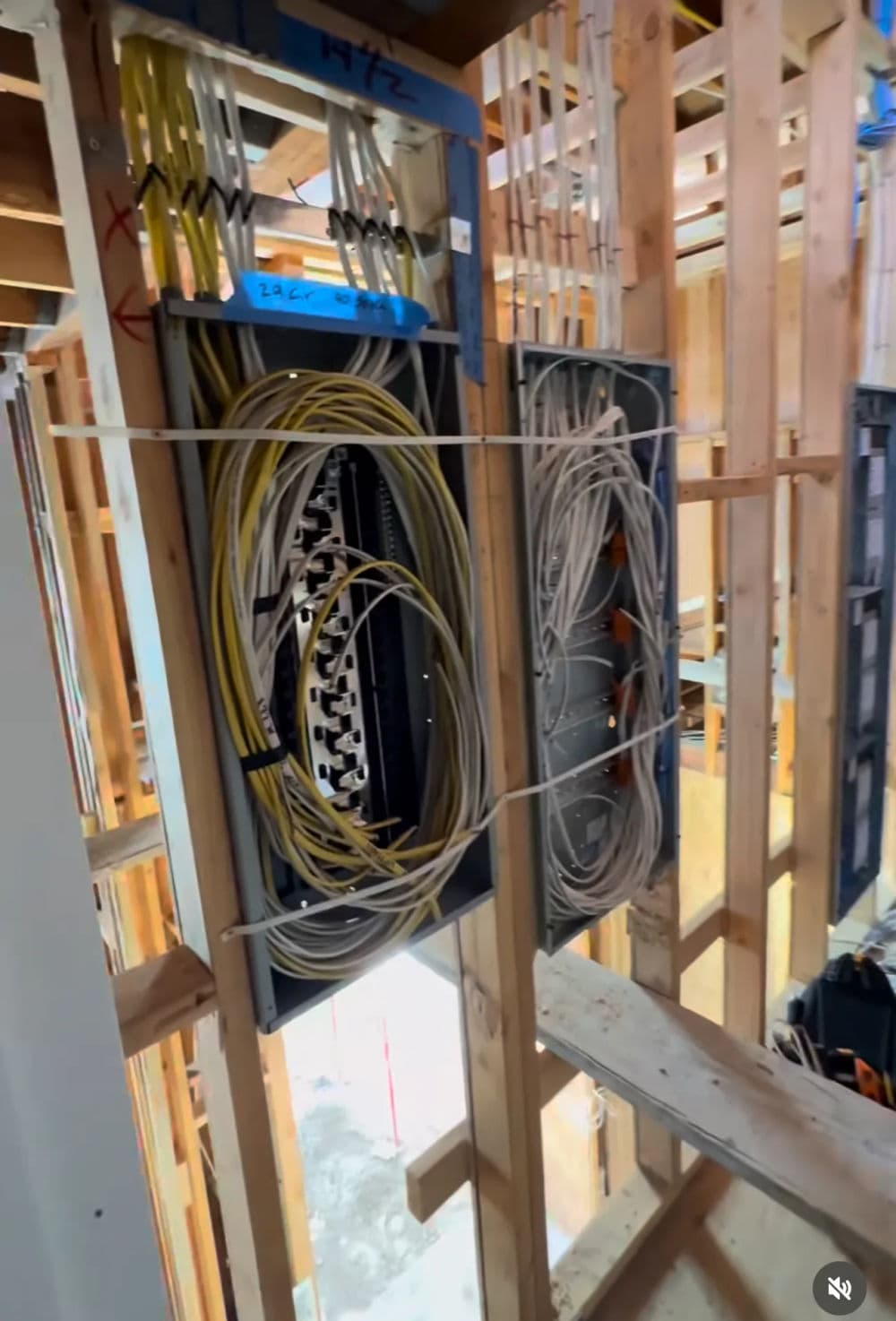 Wire management system installed in wooden framework during construction.